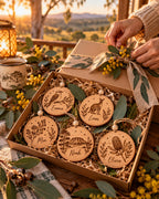 Gift box of engraved wooden Christmas ornaments with native wattle