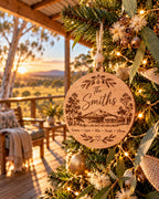 Personalised wooden Christmas ornament on a tree with Australian gum leaves