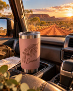 Engraved tumbler in a 4WD cup holder on an outback track