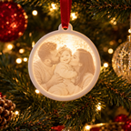 Close-up of the glowing family photo detail on a round lithophane Christmas ornament
